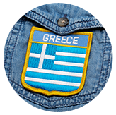Patch of the Greek flag on denim fabric.